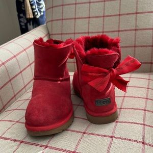 Women’s red short Ugg boots with ribbon